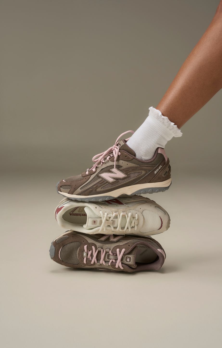 Close up of someone wearing new balance 204s